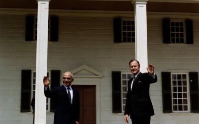 President George H. W. Bush and King Hussein of Jordan pose for pictures on Mount Vernon's iconic east lawn overlooking the Potomac River in 1989. (MVLA)…